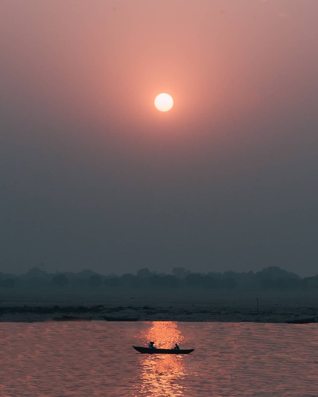 James Tran canoe water sunset calming images
